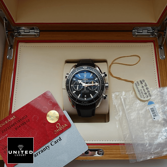 Omega Seamaster Full Blue Inspired in the box next to warranty card