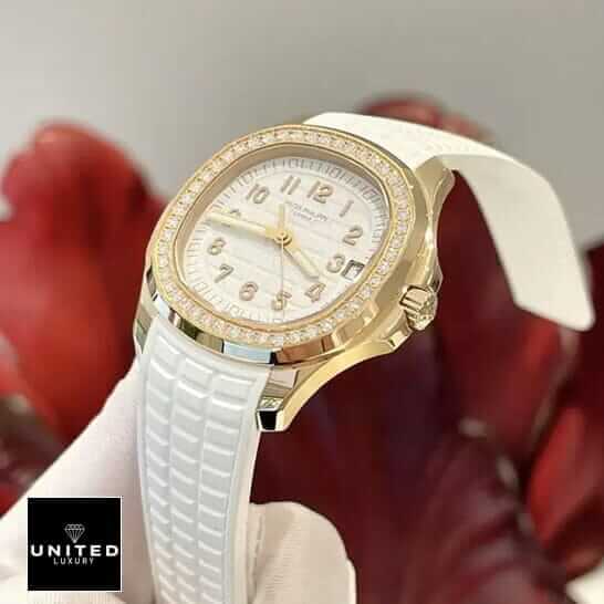 Patek Philippe Aquanaut Luce Diamond Bezel Gold Case Inspired red background