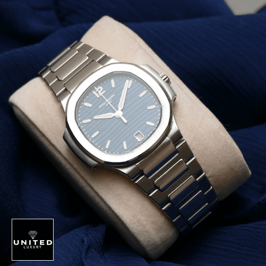 Patek Philippe Nautilus 71181A-001 Steel Bezel Inspired on the stand blue background